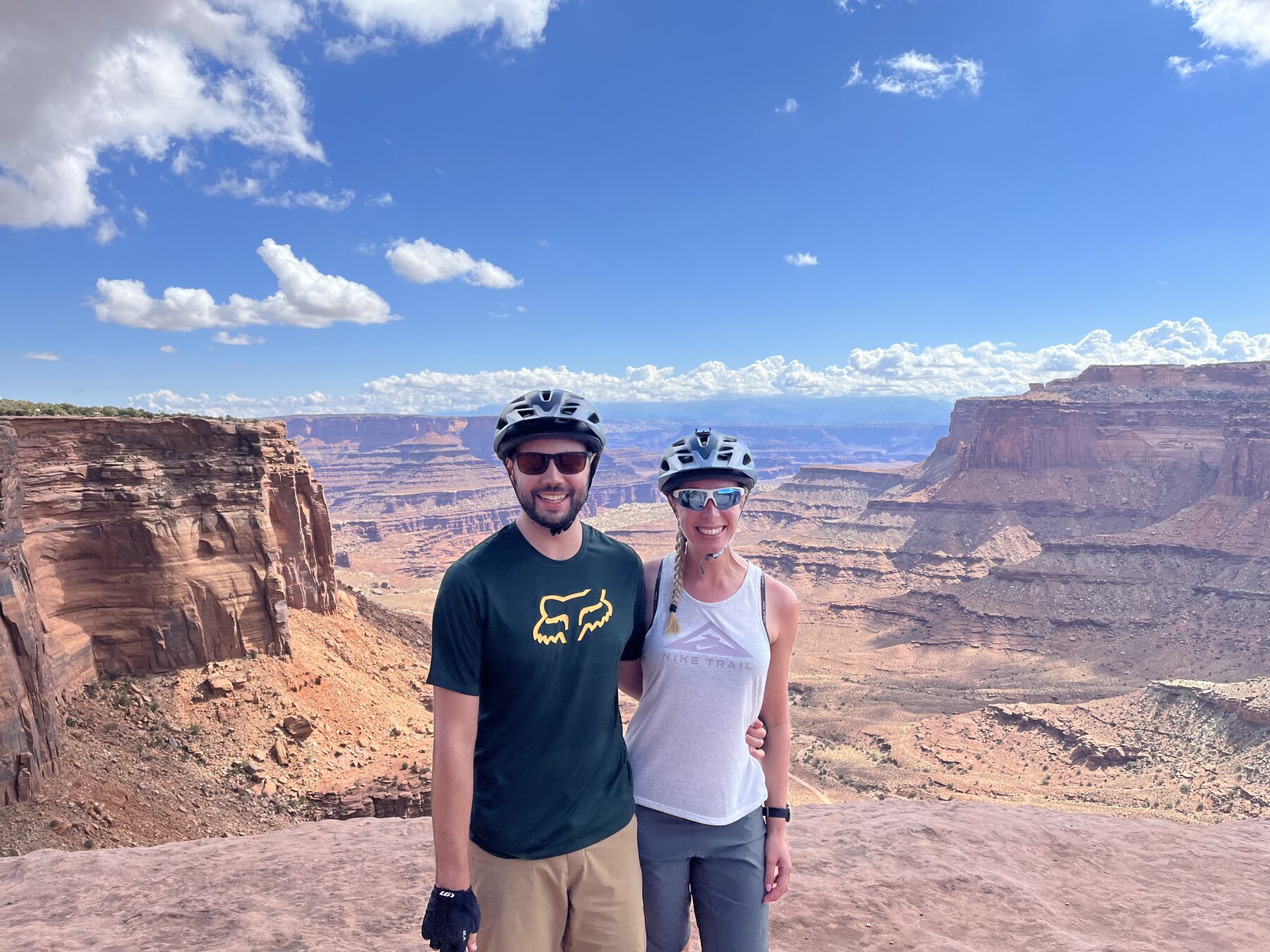 Tom and Alana hiking through a canyon landscape